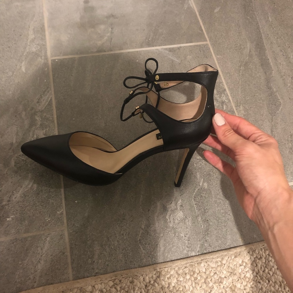 Black leather pumps
